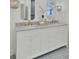 Bright bathroom boasts double vanity, marble countertop, and modern fixtures at 126 Sparrow Dr, Isle of Palms, SC 29451
