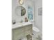 Bathroom featuring vanity with stone countertop, sink, commode and outdoor views at 126 Sparrow Dr, Isle of Palms, SC 29451