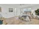 Bright bedroom with hardwood floors, stylish decor, large windows, and a serene ambiance at 126 Sparrow Dr, Isle of Palms, SC 29451