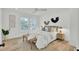Airy bedroom with natural light, neutral tones, king bed and accent bench at 126 Sparrow Dr, Isle of Palms, SC 29451
