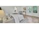 Inviting bedroom featuring bright natural light, hardwood floors, and tasteful decor at 126 Sparrow Dr, Isle of Palms, SC 29451