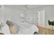 Bedroom featuring king bed, white comforter, and view of the entryway at 126 Sparrow Dr, Isle of Palms, SC 29451