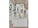 Bright butler's pantry with white cabinetry, open shelving, stylish decor, and elegant tile backsplash at 126 Sparrow Dr, Isle of Palms, SC 29451