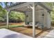 Well-appointed cabana with comfortable seating and multiple porch swings at 126 Sparrow Dr, Isle of Palms, SC 29451
