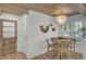 Charming dining area with natural wood accents, stylish lighting, and views of the surrounding landscape at 126 Sparrow Dr, Isle of Palms, SC 29451