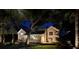 Charming white farmhouse exterior with lush landscaping and inviting outdoor living space for relaxation at 126 Sparrow Dr, Isle of Palms, SC 29451