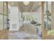 Bright foyer showcasing an open floor plan, wood-beamed ceiling, and views of the living area at 126 Sparrow Dr, Isle of Palms, SC 29451