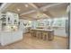Spacious kitchen with wooden beams, a central island, and modern appliances under elegant lighting at 126 Sparrow Dr, Isle of Palms, SC 29451