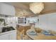 Open-concept kitchen flowing into the dining area, featuring modern appliances and a central island at 126 Sparrow Dr, Isle of Palms, SC 29451