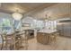 Open kitchen design featuring a large island, stainless steel appliances, and a cozy dining nook at 126 Sparrow Dr, Isle of Palms, SC 29451