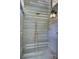 Rustic outdoor shower featuring copper fixtures and a wood-paneled enclosure at 126 Sparrow Dr, Isle of Palms, SC 29451