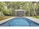 Stunning pool with a modern cabana featuring swing seating for relaxation at 126 Sparrow Dr, Isle of Palms, SC 29451