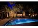 Beautiful backyard pool with lush landscaping and cozy outdoor seating area, perfect for relaxing at 126 Sparrow Dr, Isle of Palms, SC 29451