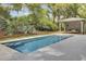 Modern pool with a geometric design, light-colored patio, and a cabana lounge area at 126 Sparrow Dr, Isle of Palms, SC 29451