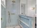 Shower with gold fixtures and blue tile at 126 Sparrow Dr, Isle of Palms, SC 29451