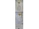 Elegant shower with gold fixtures and gray marble tile at 126 Sparrow Dr, Isle of Palms, SC 29451