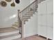 Elegant staircase with wooden steps and black iron spindles at 126 Sparrow Dr, Isle of Palms, SC 29451