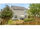 View of the home's backyard with a patio, furniture, and a well-maintained lawn at 1426 Tannery Row, Johns Island, SC 29455