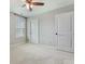 This bright bedroom has neutral walls, carpet and features two doors and a bright window at 1426 Tannery Row, Johns Island, SC 29455