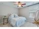 Comfortable bedroom featuring soft lighting, ceiling fan, and calming blue accents at 1426 Tannery Row, Johns Island, SC 29455