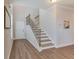 Bright foyer showcases staircase with iron railings and wood treads at 1426 Tannery Row, Johns Island, SC 29455