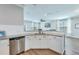 View of modern kitchen featuring stainless steel appliances, granite countertops, and stylish white cabinetry at 1426 Tannery Row, Johns Island, SC 29455