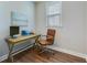 Bright home office featuring wood desk, modern chair, and wood flooring at 1426 Tannery Row, Johns Island, SC 29455