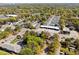 Aerial view of a residential neighborhood with streets, trees, and various buildings at 1456 Remount Rd, North Charleston, SC 29406