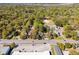 An aerial view of a quiet street filled with trees and buildings at 1456 Remount Rd, North Charleston, SC 29406