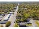 An aerial view featuring a long street with lots of trees surrounding the town at 1456 Remount Rd, North Charleston, SC 29406