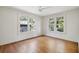 Bedroom showcasing hardwood floors, neutral walls, and double windows offering natural lighting at 1456 Remount Rd, North Charleston, SC 29406