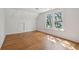 Bright bedroom featuring hardwood floors and large windows providing natural light at 1456 Remount Rd, North Charleston, SC 29406