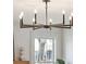 Modern chandelier hangs in a room with a window view of the outdoors and an elegant decor at 1456 Remount Rd, North Charleston, SC 29406
