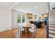 Bright, open kitchen with wood floors, a black island, stainless steel appliances, and lots of natural light at 1456 Remount Rd, North Charleston, SC 29406