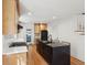 Modern kitchen featuring an island with bar seating, stainless steel appliances, and hardwood floors at 1456 Remount Rd, North Charleston, SC 29406