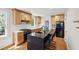 Contemporary kitchen featuring an island with bar stools, stainless steel appliances, and light wood cabinetry at 1456 Remount Rd, North Charleston, SC 29406