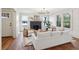 Cozy living room with hardwood floors, a black fireplace, and comfortable seating under a modern chandelier at 1456 Remount Rd, North Charleston, SC 29406