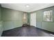 Spacious room with tile flooring, neutral walls, and a door leading to an outdoor area at 1456 Remount Rd, North Charleston, SC 29406
