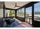 Bright sunroom with brick walls, tile flooring, and large windows offering views of the outdoors at 1456 Remount Rd, North Charleston, SC 29406