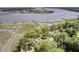 Beautiful aerial shot of a waterfront property, showing private docks and lush greenery at 146 Rivers Edge Way, Wando, SC 29492