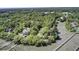 Expansive aerial showcasing the house amidst a dense canopy of trees at 146 Rivers Edge Way, Wando, SC 29492