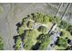 Overhead shot of a property with dense trees, a large lawn, and nearby docks at 146 Rivers Edge Way, Wando, SC 29492