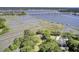 Stunning aerial view of waterfront property with private docks and lush greenery at 146 Rivers Edge Way, Wando, SC 29492