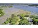 Stunning aerial view showcasing the waterfront property, marshlands, and long private docks at 146 Rivers Edge Way, Wando, SC 29492