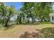 View of the expansive backyard featuring mature trees offering shade and privacy at 146 Rivers Edge Way, Wando, SC 29492