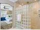 Luxurious shower room with glass block and stone tile at 146 Rivers Edge Way, Wando, SC 29492