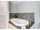Contemporary bathtub with modern tile backsplash at 146 Rivers Edge Way, Wando, SC 29492