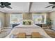 Sun-filled bedroom features large windows and modern décor at 146 Rivers Edge Way, Wando, SC 29492