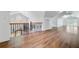 Bonus room with hardwood floors, decorative railing, and large windows providing natural light at 146 Rivers Edge Way, Wando, SC 29492