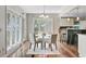 Charming breakfast nook features a round table, hardwood floors, and bright natural light at 146 Rivers Edge Way, Wando, SC 29492